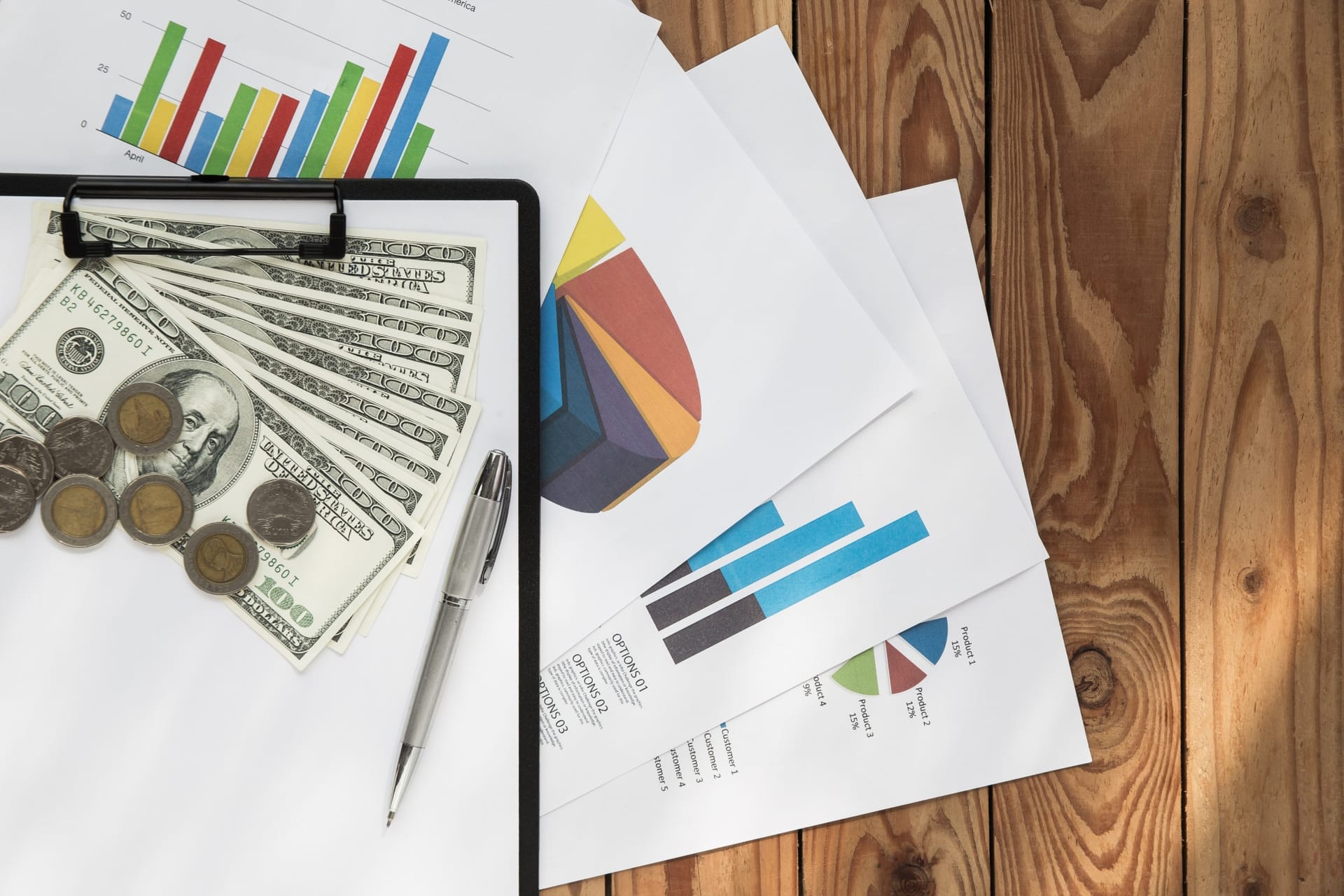 Two sets of financial documents side by side under review